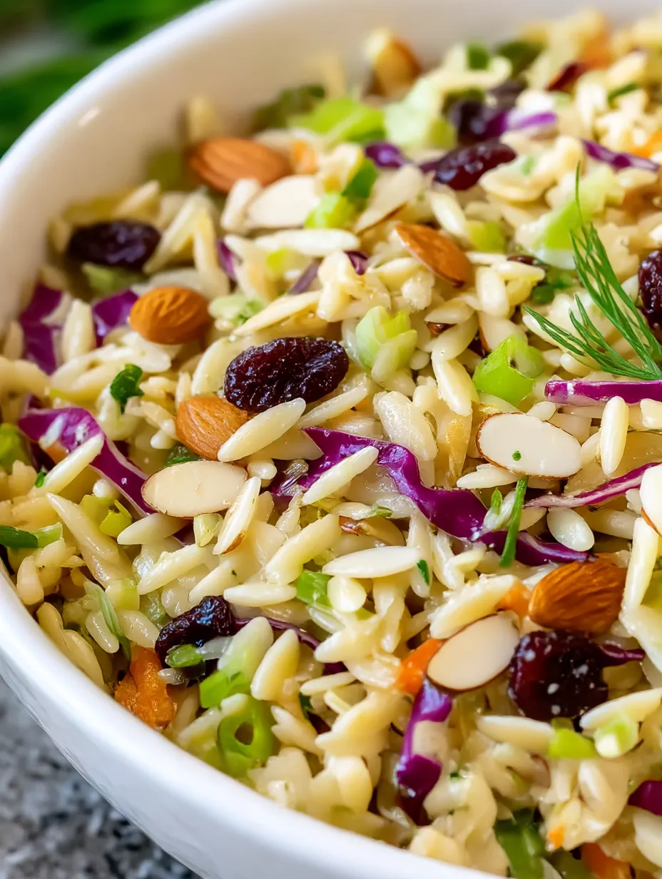 Rice bowl topped with veggies and nuts.