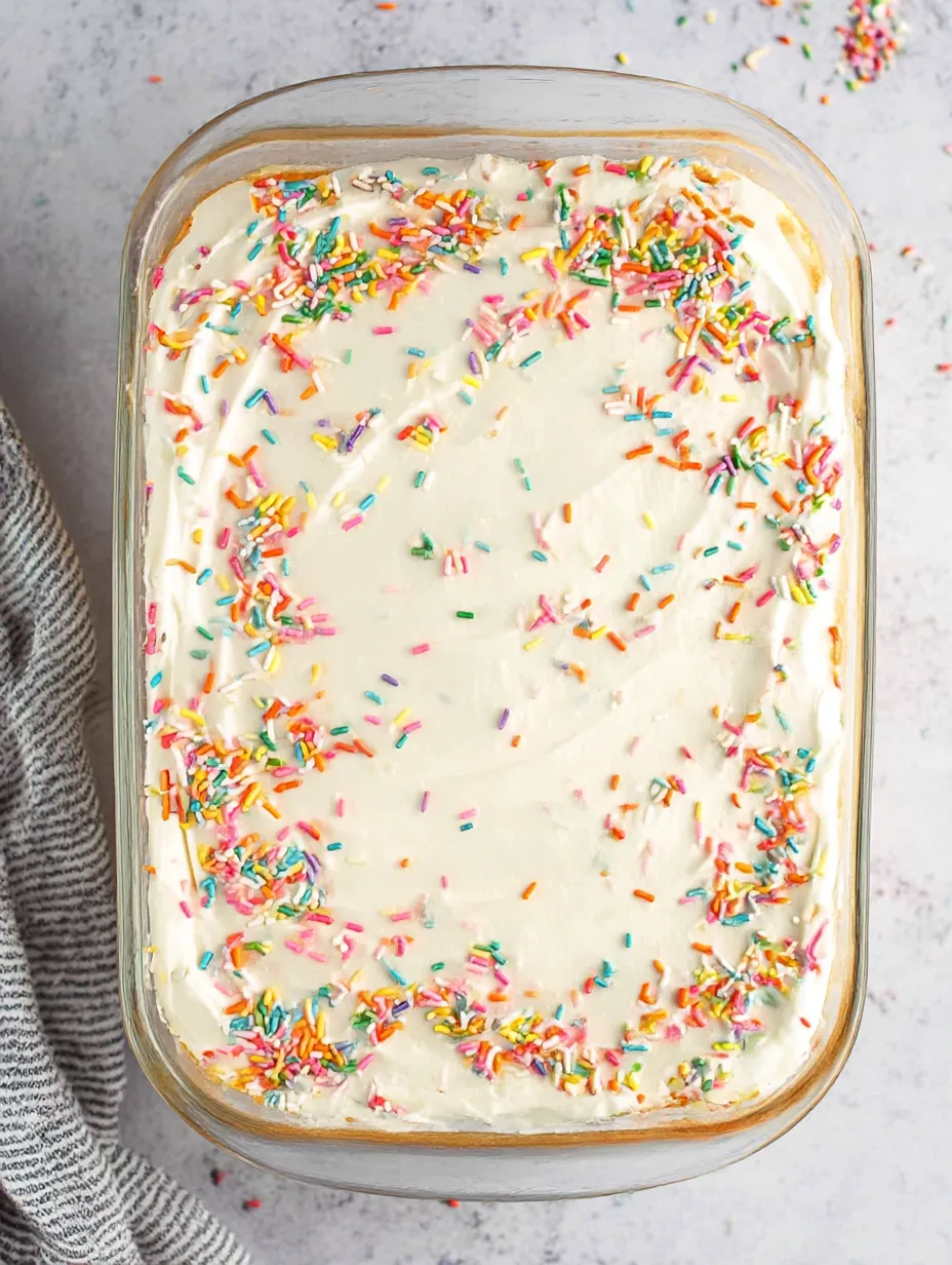 A cake finished with colorful sprinkles.