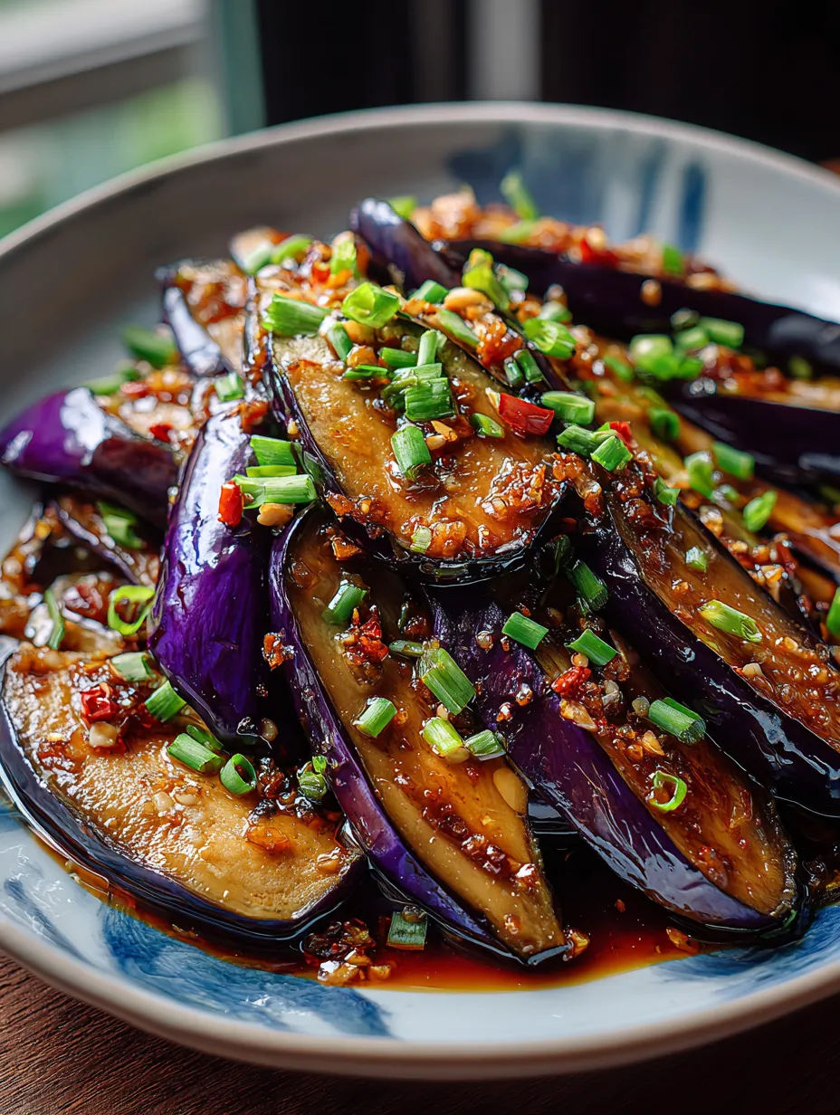 A plate full of Chinese Eggplant with Garlic Sauce.