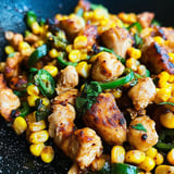 A delicious meal of chicken and corn on the cob, cooked to perfection.